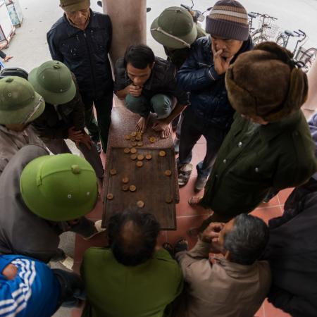 Exciting game of Chinese chess. Tam Coc, Ninh Binh Province, Vietnam. December 2017.